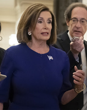 Speaker of the House Nancy Pelosi, D-Calif., is questioned by reporters as she departs the Capitol en route to a speaking event in Washington, Tuesday, Sept. 24, 2019. Pelosi will meet with her caucus later as more House Democrats are urging an impeachment inquiry amid reports that President Donald Trump pressured Ukraine to investigate former Vice President Joe Biden and his family. (AP Photo/J. Scott Applewhite)